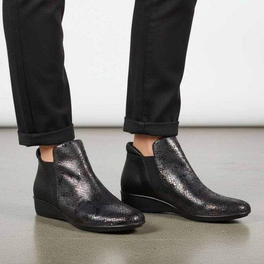 Lifestyle image for Damascus Wedged Boot - Black Metallic Python/Onyx